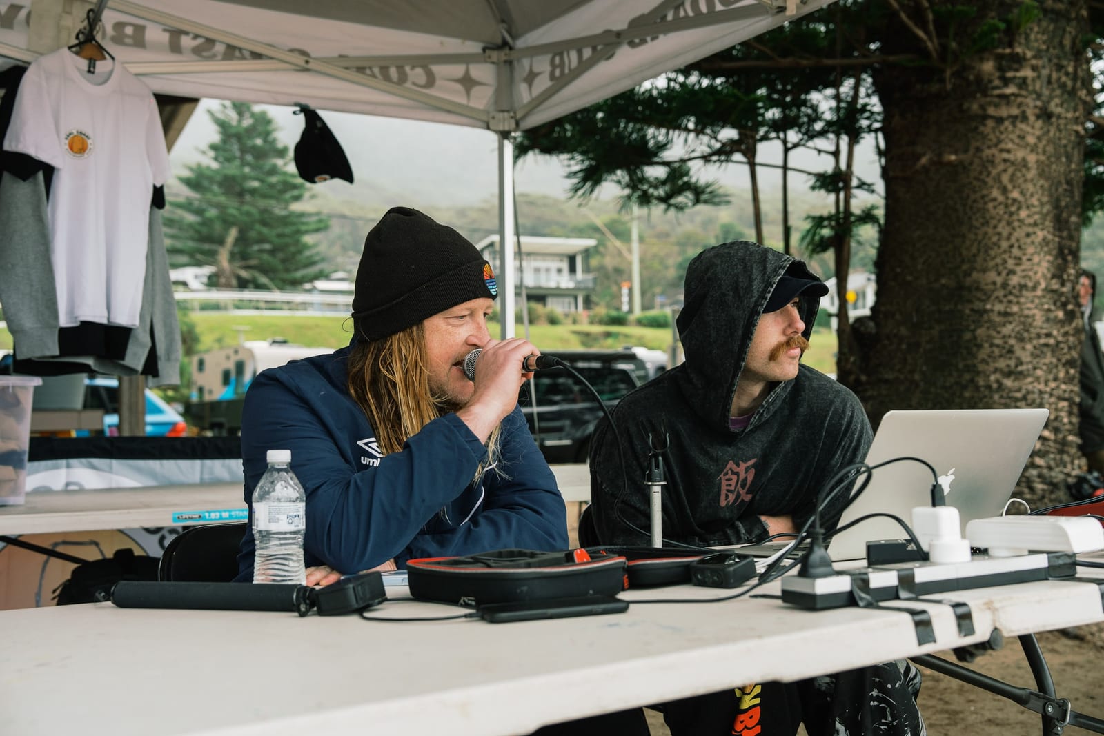 Two club volunteers at the judging desk under the CCBC marquee